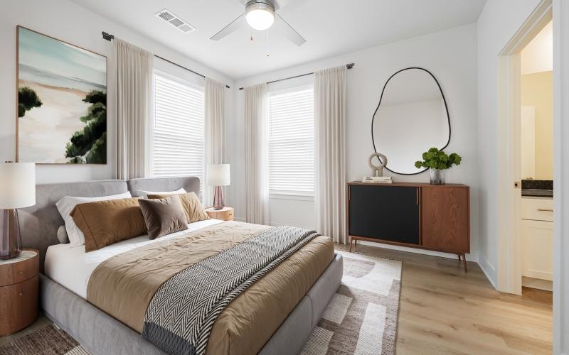 a bedroom with a large mirror