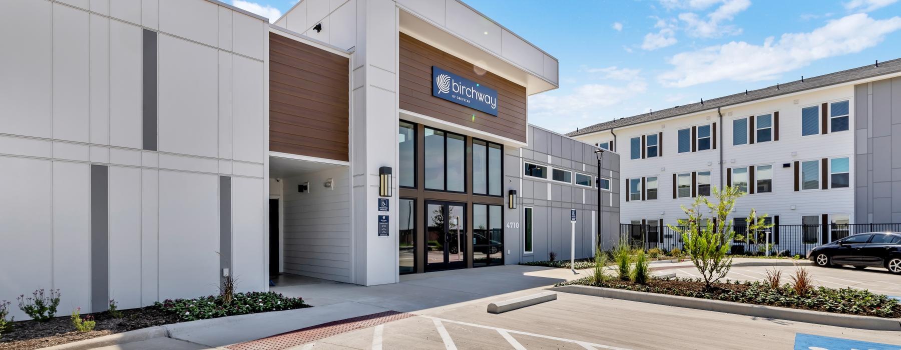 a building with a parking lot